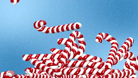Falling candy canes isolated on snowy background Stock Footage 143659190