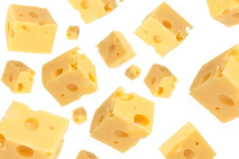 Falling cheese cubes, isolated on white background, selective focus. Maasdam Stock Photos
