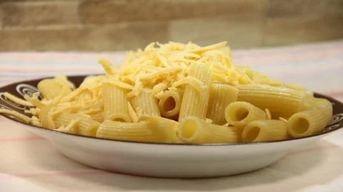 Falling cheese on pasta, plate, flour, pasta, breakfast, Video stock 75779913