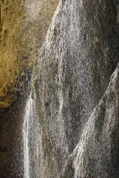 Falling Chegem waterfall with splashes in the mountains Stock Photos