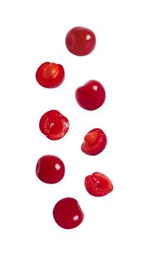 Falling cherries isolated on a white background. Flying berries for packaging Stock Photos