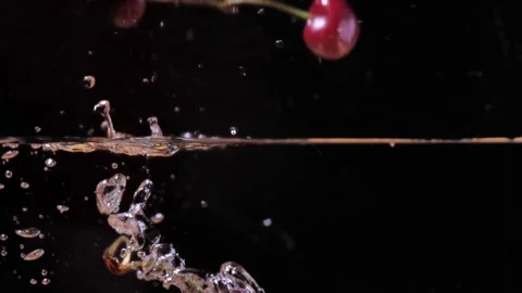 Falling cherries into the water. cherry in slow motion Stock Footage 201338798