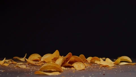 Falling chips and chili peppers, food porn, 120fps, 2.6k Stock Footage 130799872