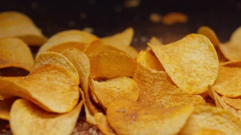 Falling chips and chili peppers, food porn, 120fps, 2.6k Stock Footage 130799873
