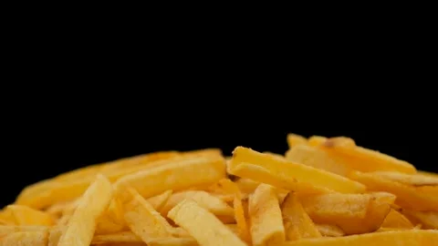 Falling chips on a black background. Slow motion. Close up. The beer snack drops Stock Footage 135675199