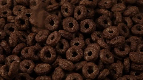 Falling chocolate breakfast cereals, close-up in slow motion Stock Footage