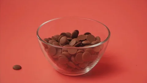 Falling Chocolate in Glass Cup Stock Footage 106983984