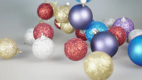 Falling christmas ball on white background Stock Footage 236747639