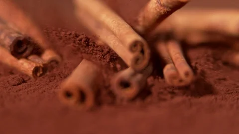Falling cinnamon into powder in super slow motion. Video stock 101075666