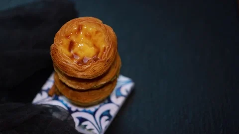 Falling cinnamon on typical Portuguese egg tart Pastel de nata Video stock 88798608