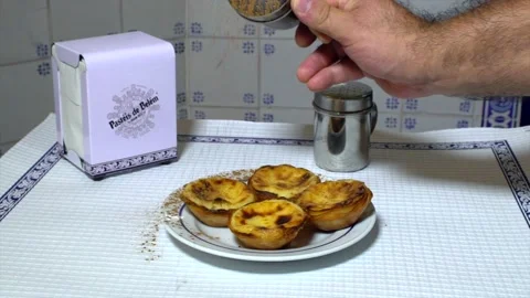 Falling Cinnamon On Typical Portuguese Egg Tart Pastel De Belem 60fps 動画素材 187079267
