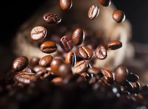 Falling coffee beans Stock Photos