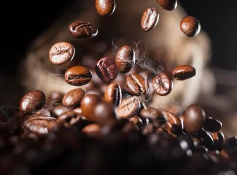 Falling coffee beans Stock Photos