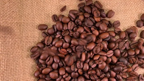 Falling coffee beans, rotating Stock Footage 220669837