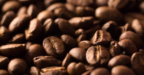 Falling Coffee Beans Slow Motion on background close up macro shot Stock Footage 98240298