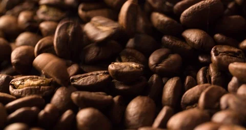 Falling Coffee Beans Slow Motion on blurred background macro shot Stock Footage 98241119