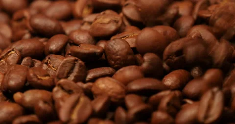 Falling coffee beans on turning Видео 162610640