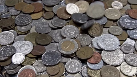 Falling coins of different countries in close-up and slow motion Stock Footage 158648125