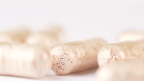 Falling Collagen capsules on white background, macro shot. Stock Footage 301712536