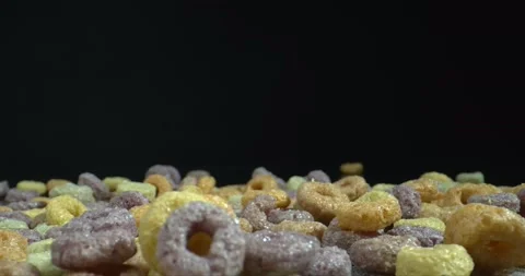 Falling colored Cereal Hoops on mound of it. Stock Footage 143171215