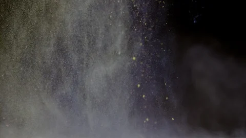 Falling colored dust on black background, Ultra Slow Motion Stock-Footage 86576550