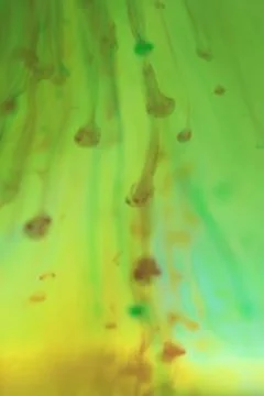 Falling Colored Paint Drops Dynamic Motion. Soft Ambient Background. Stock Photos