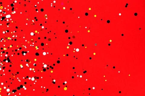 Falling confetti on red background Stock Photos