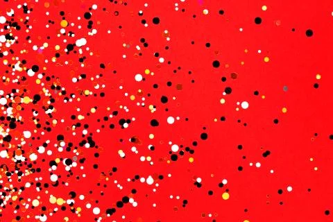 Falling confetti on red background Stock Photos