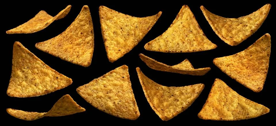 Falling corn chips, hot Mexican nachos isolated on black background Fallin... Stock Photos
