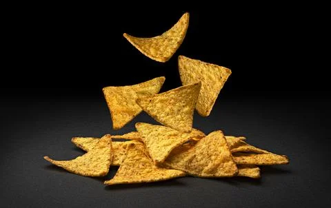 Falling corn chips, hot Mexican nachos isolated on black background Foto stock