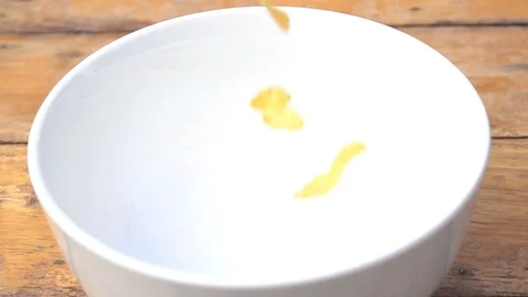 Falling of corn flake in real slow motion (250 FPS) Stock Footage 90621793