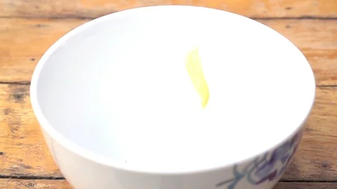 Falling of corn flake in real slow motion (250 FPS) Stock Footage 90623023