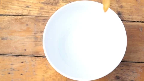 Falling of corn flake in real slow motion (250 FPS) Stock Footage 90623250