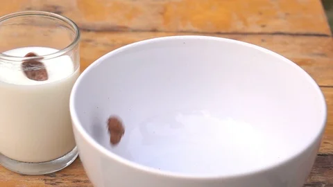 Falling of corn flake in real slow motion (250 FPS) Stock Footage 90623644