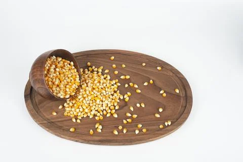 Falling corn seeds isolated  collection of raw yellow corn grains Stock Photos