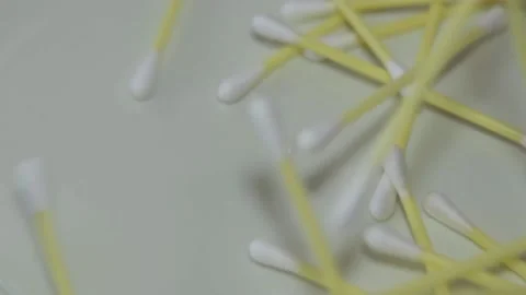 Falling cotton swabs in slow motion scattered across the surface. Stock Footage 184087156