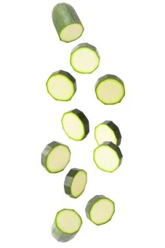 Falling courgettes isolated on white Stock Photos