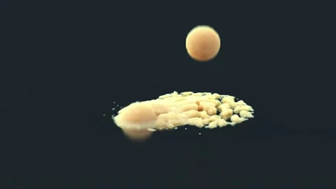 Falling crumbling balls Stock Footage 164859228