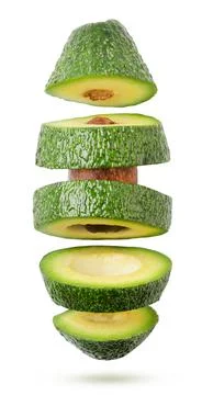 Falling cut avocado on a white background, cut. Isolated Stock Photos