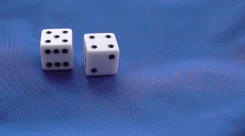Falling dice on blue background Stock Footage