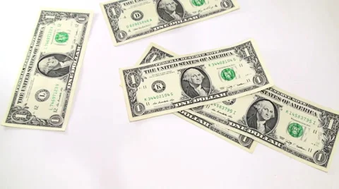 Falling different dollar bills on white background Stock Footage 61219292
