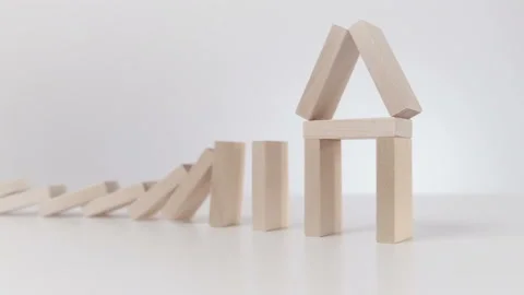 Falling Domino Breaking the Figure in Shape of Home. Slow Motion Stock Footage 143321364