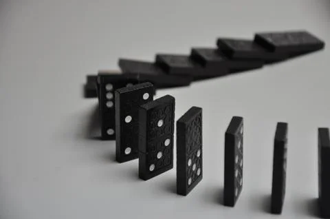 Falling domino Stock Photos
