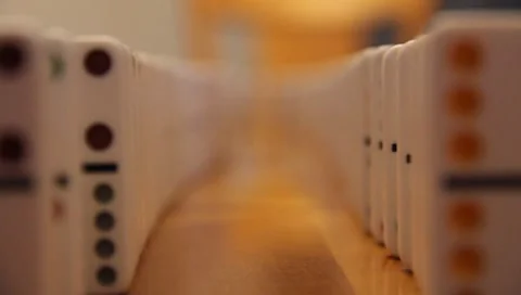 Falling Dominos In A Line Part #3 Stock Footage 7748753