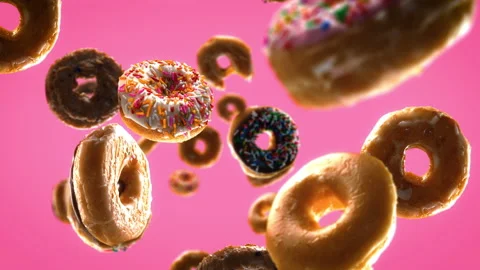 Falling Donuts on a Pink Background Stock Footage 237041083