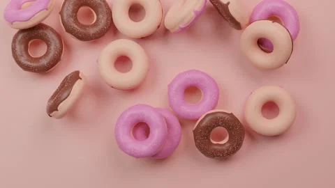 Falling donuts on pink pastel background. Seamless loop animation. Stock Footage 133343679