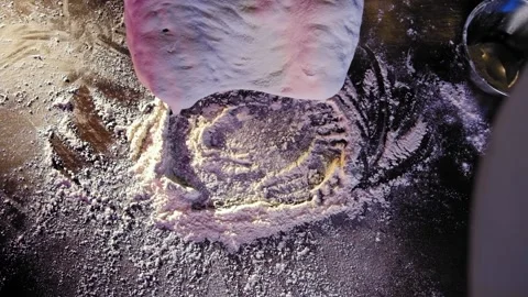 Falling dough into flour on table Stock Footage 170232958