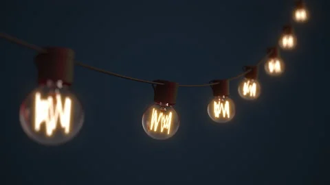 Falling down, hanging string lights. Bright shining and glowing  lights Stockbeeldmateriaal 163967107