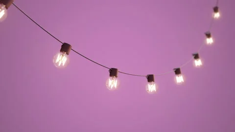 Falling down, hanging string lights. Shining, glowing decorative lights Stock Footage 164208773