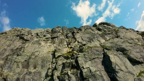 Falling Down the Mountain: Reverse FPV Drone Flight Stock Footage 282398394